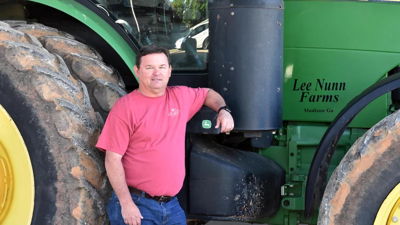 lee nunn in front of tractor