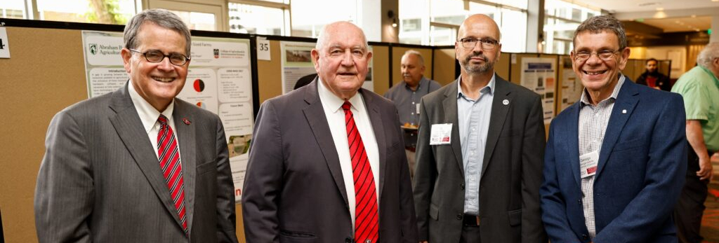 Group photo: Jere Morehead, Sonny Perdue, Jaime Camelio, and George Vellidis at the 2023 IPA Conference.