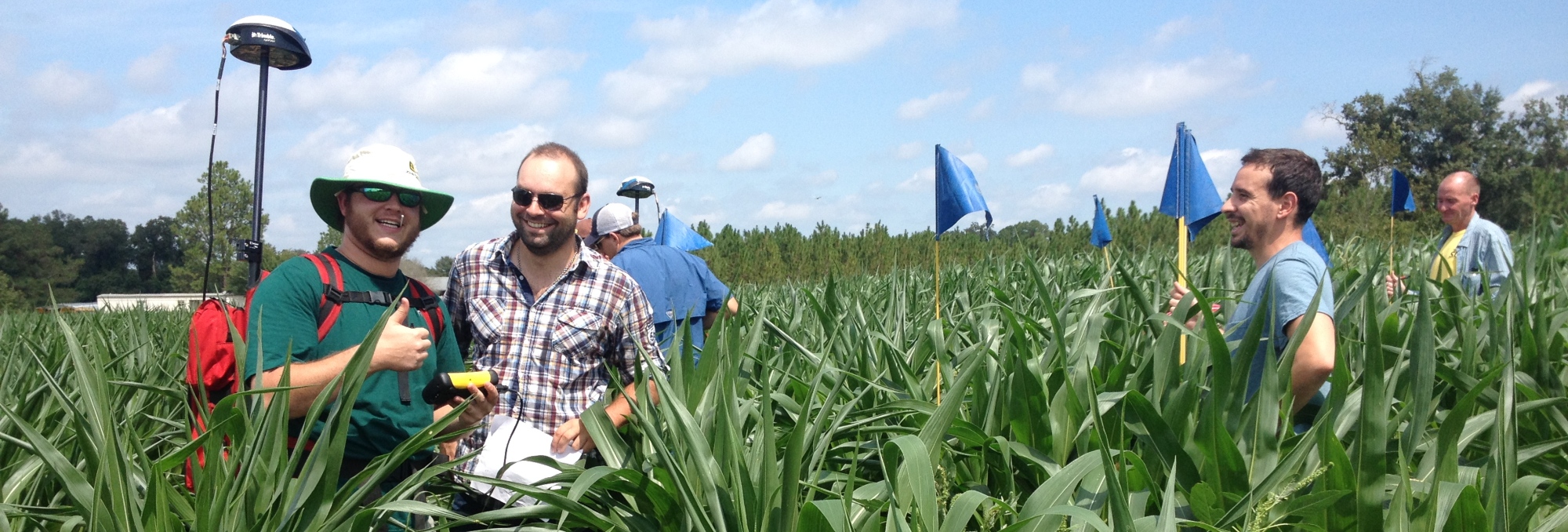 Students in the CRSS 3030 class help layout the coordinates for a corn maze at Rutland Farm, Tifton GA.