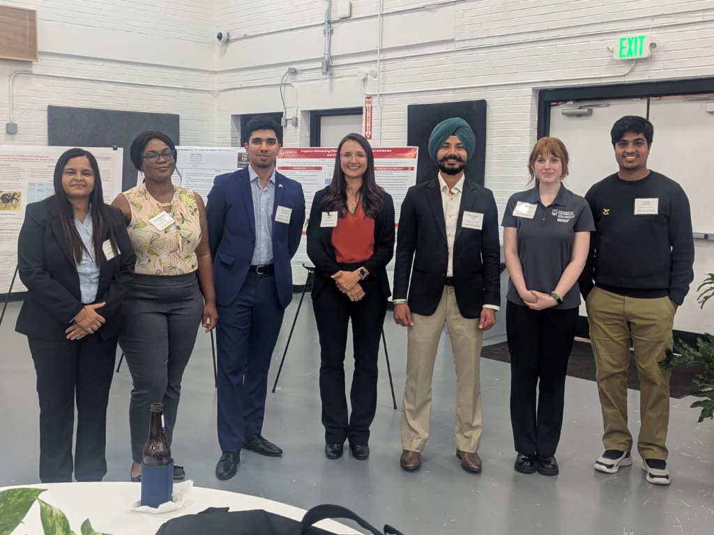 L-R: Priyanka Dahiya, Emmanuella Bredu, Muneeb Elahi Malik, Dr. Lorena Lacerda (poster competition coordinator), Taranjeet Sodhi, Madelyn Willis, and Anish Bhattarai.