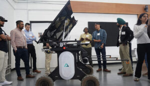 Aigen co-founder Kenny Lee (third from right) demonstrates the Aigen Element, an autonomous weeding system for farms, at last week’s Integrative Precision Agriculture Conference. Lee was one of eight UGA Grand Farm partners to present at the conference. (Photo by David Mitchell)